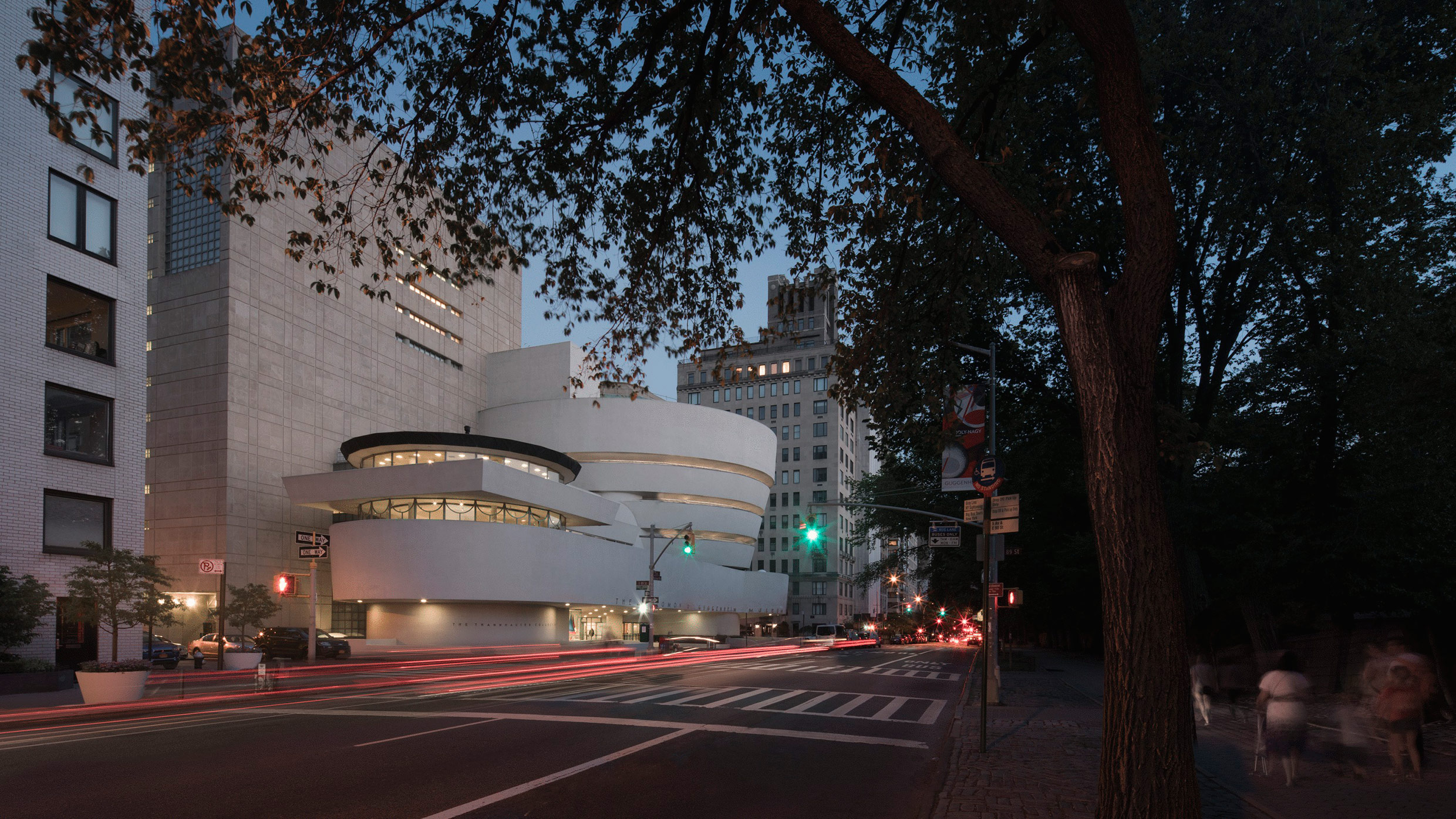 A view of the Solomon R. Guggenheim Museum in New York City at late dusk.