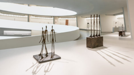 Sculpture of three tall thin people in the Solomon R. Guggenheim Museum