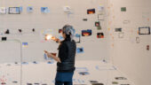Artist Sarah Sze installs various images and lighting in the Guggenheim Museum.